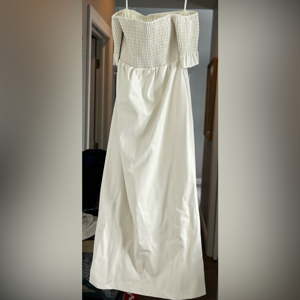 Smocked top and sleeves.Fabric is leatherette.So soft and gorgeous!